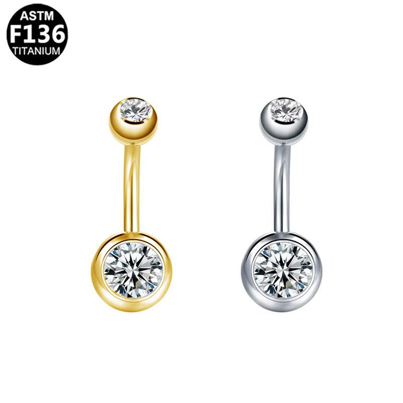 Bauchnabel- oder Intimpiercing aus ASTM F136 Titan mit doppelten eingefassten Zirkonia Kristall in Silber & Gold aus der Royal Essentials Kollektion. 